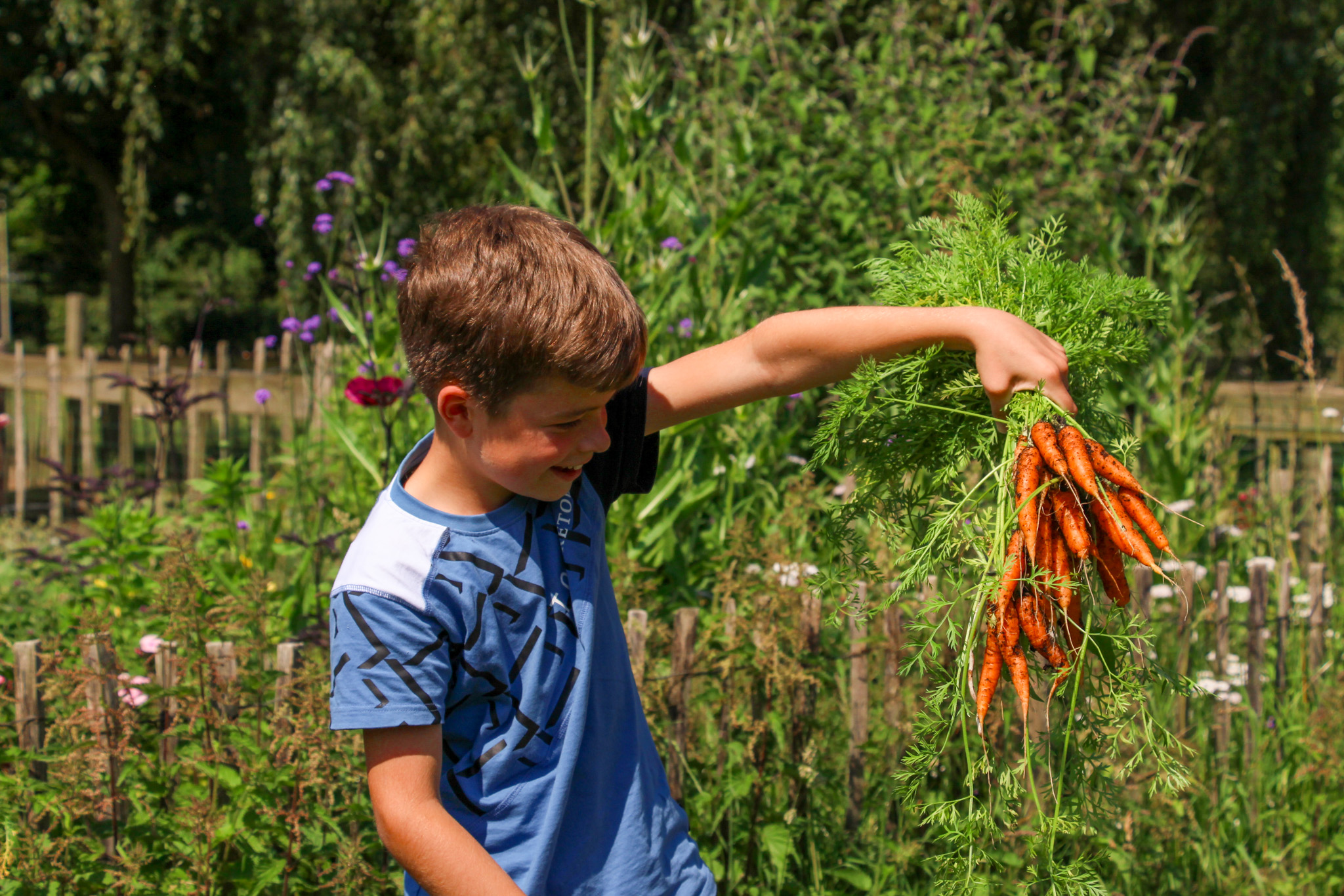 Oogstfeest op de schooltuin van bs De Hazesprong bij Kinderboerderij De Goffert